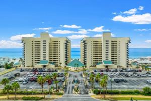an aerial view of a parking lot at a resort at Beachfront Condo With Beautiful Sunset in Panama City Beach