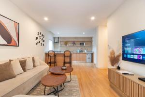 a living room with a couch and a table at Aima Apartments in Lagos