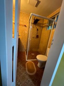 a bathroom with a shower and a toilet at Casa do Sal in São Luís +18 photos