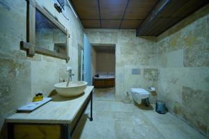 a bathroom with a sink and a toilet at Nirvana Cave House in Avcılar +148 photos