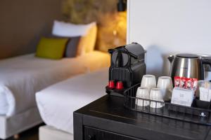 a coffee maker on a table in a hotel room at Van der Valk Hotel Saint-Aygulf in Saint-Aygulf