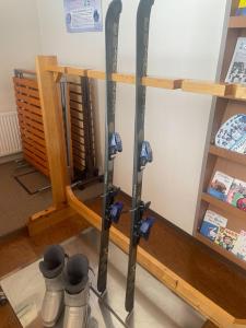 a group of skis on display in a store at Minowa airbnb in Yubari +62 photos