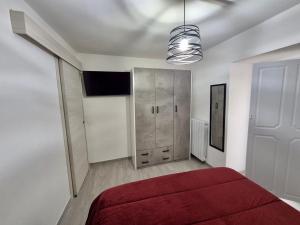 a bedroom with a red bed and a closet at Residenza Aurora in Isernia