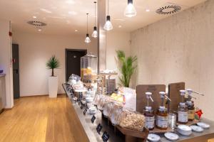 a room with a counter with many bottles on it at LVG Hotel Collection - Gardenia in Verona