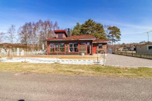 a house is under construction with a fence at HAL901-Skummesloevsstrand-Rundan-37 in Skummeslövsstrand