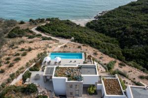 an aerial view of a house on the beach at Villa Rosemary in Xiropigado