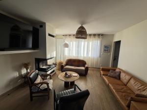 a living room with a couch and a table at Reve dOpale in Étaples