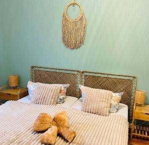 a bedroom with two beds with stuffed animals on them at MoryńApartments in Moryń