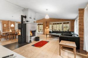 a living room with a couch and a fireplace at HA398-Saeby-Kulmulevej-9 in Lyngså