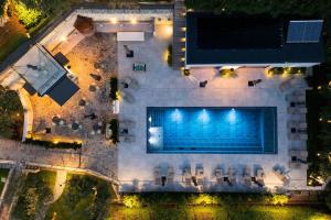 an overhead view of a swimming pool at night at Villa Bocchi by Geco Vacation Rentals in Negrar