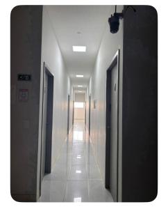 a hallway of a building with two doors and a hallwayngthngthngthngthngth at Quartos Sinop in Sinop +2 photos
