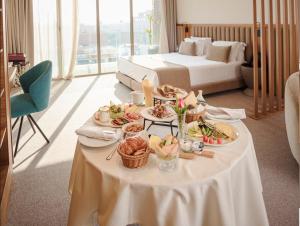 a table with plates of food on it in a hotel room at NearYo Hotels in Marrakesh