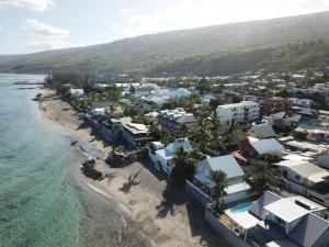 an aerial view of a beach with houses and the ocean at villa des Filaos et du lagon 0693-70'59'79 in Saint-Leu