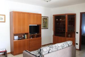 a living room with a couch and a entertainment center at Situation House in Catanzaro Lido