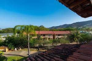 a view from the roof of a house with a palm tree at Coco Sunset Hills 52 in Coco