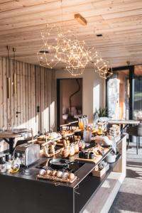 a buffet line with many food items on it at Borgo Antico Mountain Lodge in Sappada