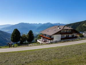 a building on the side of a road at Pension Rastnerhof in Luson