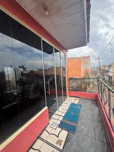 a balcony of a building with a view of a city at Casa Altos JM in Ananindeua +10 photos