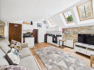 a living room with a couch and a tv at 52a Albert Street in Kirkwall