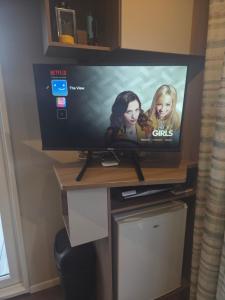 a flat screen tv sitting on top of a table at The View in Ballantrae