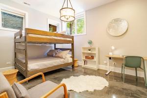 a bedroom with a bunk bed and a desk at Hello Again, Chicago! in Chicago