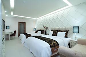 Letto o letti in una camera di Chuang-Tang Spring SPA Hotel - Deyang