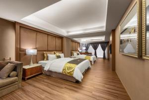 Letto o letti in una camera di Chuang-Tang Spring SPA Hotel - Deyang