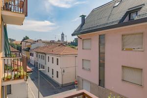a view of a city from the balcony of a building at Visconti Apartment by Rhospitality it in Rho