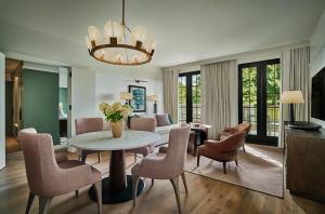 a living room with a table and chairs at Pendry Natirar in Peapack