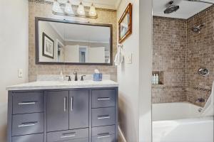 a bathroom with a sink and a mirror at White Mountain Trailhead in Campton +30 photos