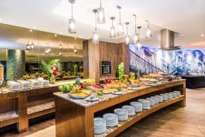 a buffet line in a restaurant with food on display at Hospedium Princess Hotel Panam&aacute; in Panama City