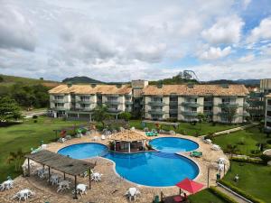 an aerial view of a resort with a swimming pool at Flats no Quartier e Village Apart Hotel in Três Poços
