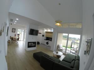 a living room with a couch and a fireplace at Casa Huidobro Valle II in Sardón de los Frailes