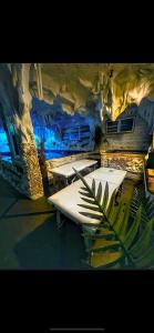 a group of boats sitting in the water in a cave at Bali Colosseum Hotel in Belgrade
