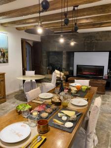 a table with food on it in a living room at Château du Puech en Aubrac in Curières