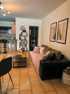 a living room with a couch and a table at Fotuso House in Majdany Wielkie