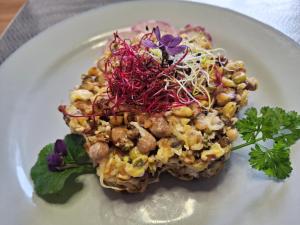 a white plate with a dish of food on it at Grande Chambre double in Sérignan +25 photos