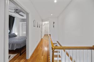 a hallway with a bedroom and a bed and a staircase at Double Room with shared bathroom in Times Square in New York +1 photo