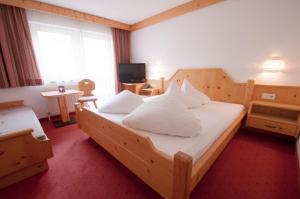 Postelja oz. postelje v sobi nastanitve Hotel Alpenfriede