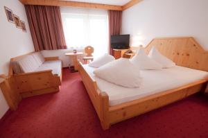 Postelja oz. postelje v sobi nastanitve Hotel Alpenfriede