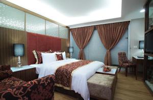 Letto o letti in una camera di Chuang-Tang Spring SPA Hotel - Deyang