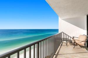 a balcony with two chairs and the ocean at One Seagrove Place 1505 in Santa Rosa Beach +53 photos
