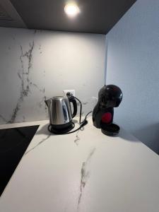 a appliance sitting on a counter in a room at Studio rénové Ovronnaz chalet Orion in Ovronnaz