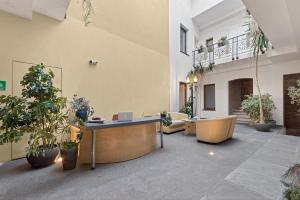 an office with potted plants in a building at Schloss Haus Boutique in Braşov
