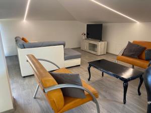 a living room with a couch and a table at Dimora Coacci in Grottammare