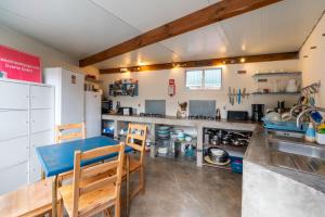 a kitchen with a table and a counter top at Amrita Shala in Colares +72 photos