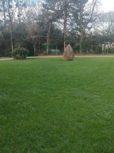 a large pile of hay in a field of grass at chambre Chez Sylvie in Allaire