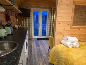 a kitchen with a sink and a counter top at Gorse Gorgeous Glamping Hideaway in Dundonnell +23 photos