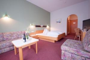 Postelja oz. postelje v sobi nastanitve Hotel Alpenfriede