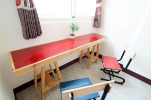 a wooden desk in a room with a chair at Taiping Homestay in Taiping